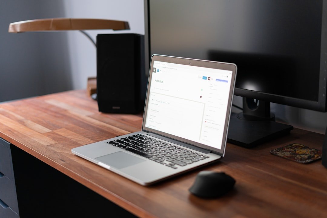 Laptop on a desk with WordPress screen.